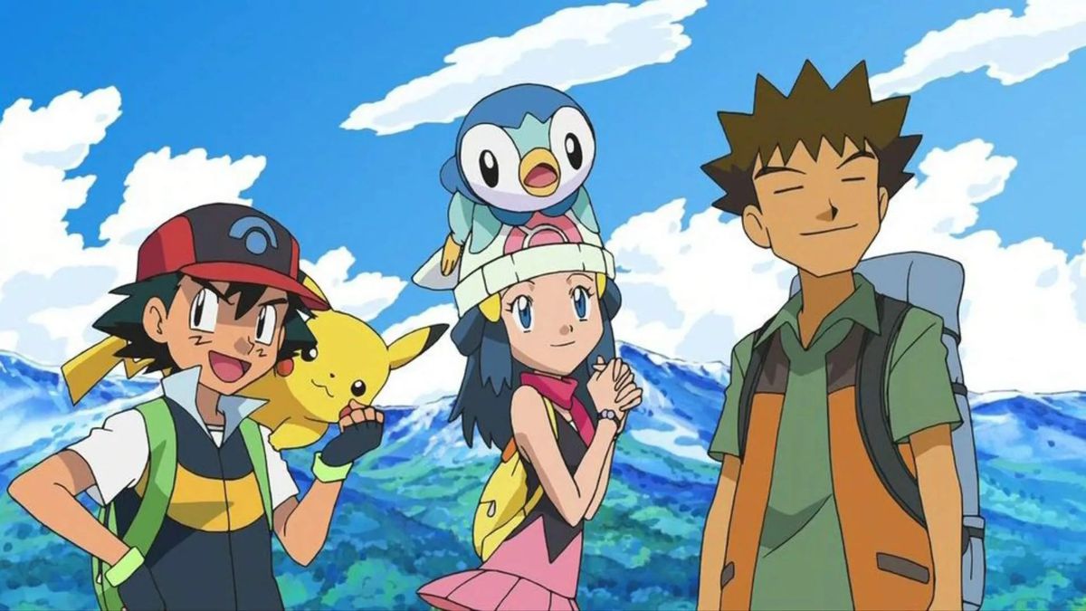 Three anime characters, one boy with black hair and a cap (Ash) with a yellow creature (Pikachu) on his shoulder, one girl with blue hair (Dawn) and a pink and white cap with a blue and white creature on her head (Piplup) and a spiky brown-haired boy with and orange and green jacket and backpack stand in front of a mountain range.