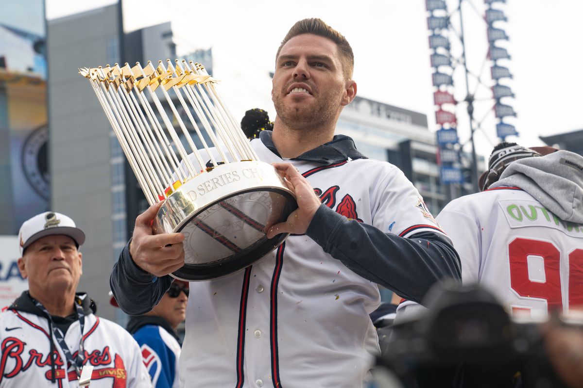 Freddie Freeman holds the Commissioner’s Trophy as members of the Atlanta Braves celebrate following their World Series Parade at Truist Park on November 5, 2021 in Atlanta, Georgia. The Atlanta Braves won the World Series in six games against the Houston Astros winning their first championship since 1995.