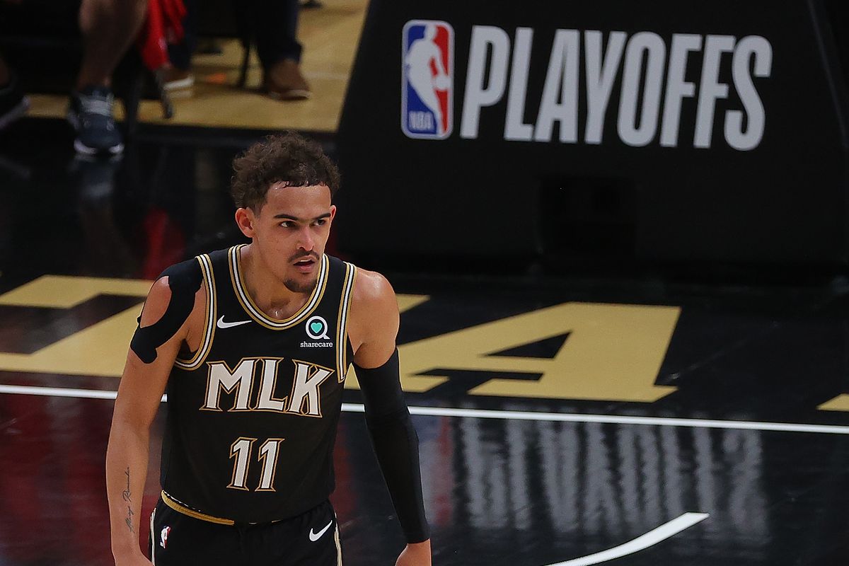 Trae Young of the Atlanta Hawks reacts after hitting a three-point basket against the Philadelphia 76ers during the second half of game 4 of the Eastern Conference Semifinals at State Farm Arena on June 14, 2021 in Atlanta, Georgia.