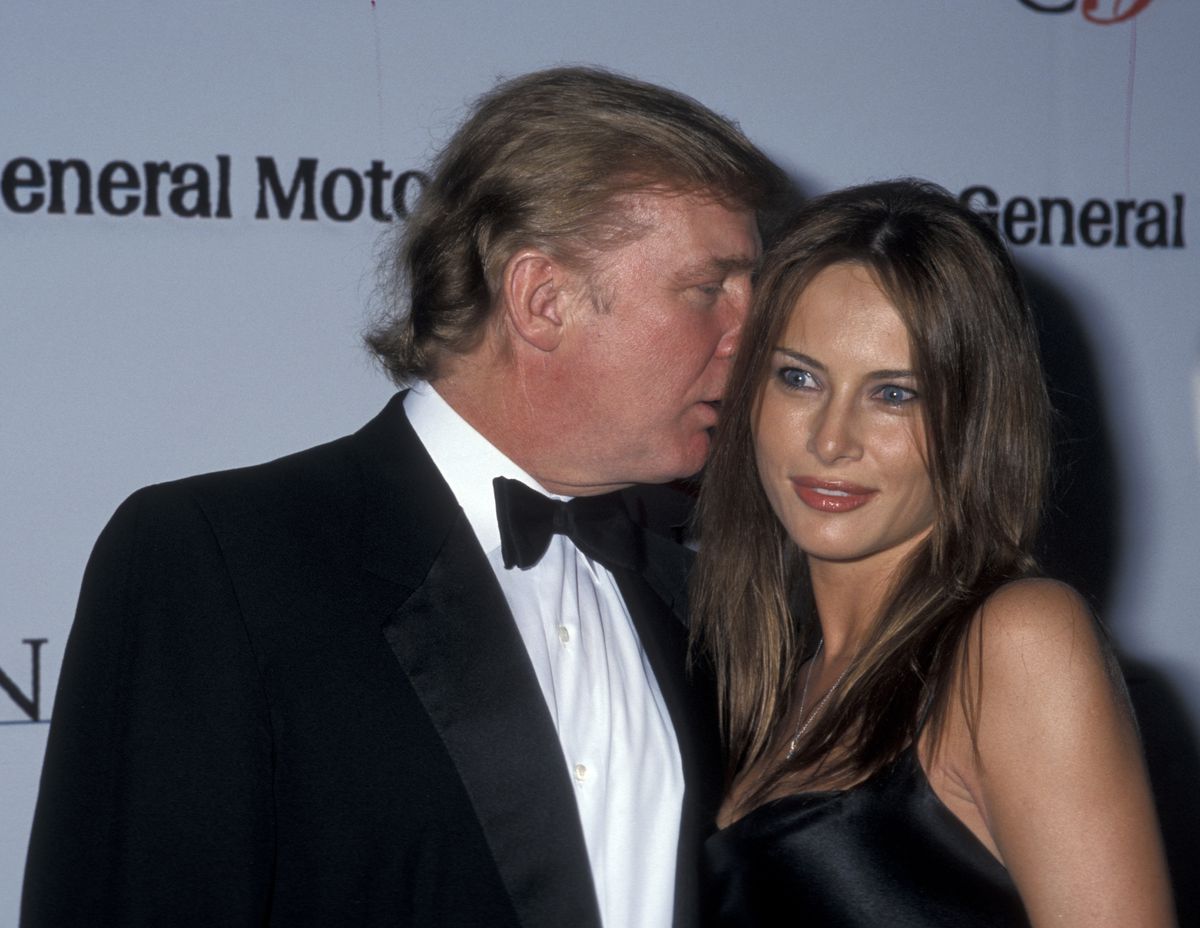 Donald Trump whispering in the ear of then-girlfriend Melania Knauss (now wife Melania Trump) in 1999.