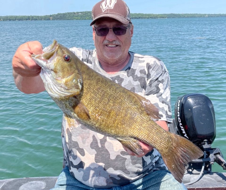 Randy Williams, from Markesan, Wis., with a 21.5-inch Green Lake smallmouth bass caught while guided by Mike Norris. Provided photo