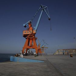 In this April 11, 2016 photo, Pakistan Navy soldiers patrol in Gwadar port, about 700 kilometers (435 miles) west of Karachi.  Pakistan's top civilian and military leaders traveled to the country's southwest on Sunday, Nov. 13, 2016,  to open a new international trade route by seeing off a Chinese ship that's exporting goods to the Middle East and Africa from the newly built Gwadar port. 