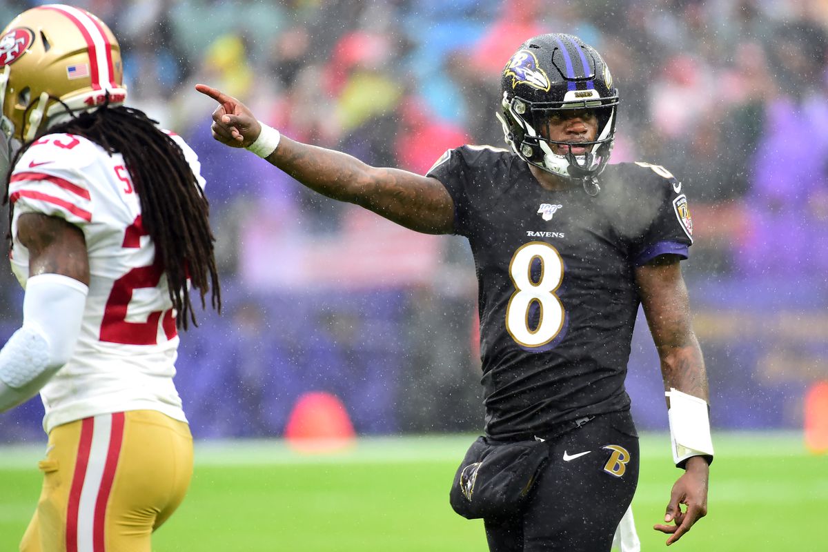 Baltimore Ravens quarterback Lamar Jackson indicates a first down in the second quarter against the San Francisco 49ers at M&amp;T Bank Stadium.