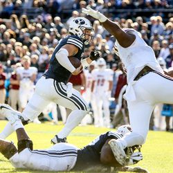Brigham Young Cougars quarterback Taysom Hill (7) runs for a touchdown, putting BYU up 41-9 after the PAT, during a game against the UMass Minutemen at LaVell Edwards Stadium in Provo on Saturday, Nov. 19, 2016.