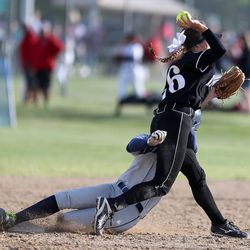 Syracuse's Kelsi Curtis is called for interfence as she slides into second base while Riverton's Alysson Houston throws to first during a 5A quarterfinal softball game at the Valley Softball Complex in Taylorsville on Tuesday, May 24, 2016. Riverton won, 5-2.