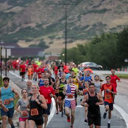 Racers in the Deseret News 10K run down Wakara Way in Salt Lake City on Tuesday, July 24, 2018.