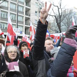 Protesters shout slogans during an anti-government demonstration in front of the Constitutional Court, in Warsaw, Poland, Sunday, Dec. 18, 2016. Opponents of the country's populist government are staging protests in an appeal to protect the young democracy's constitutional order from a series of government steps they deem anti-democratic. 