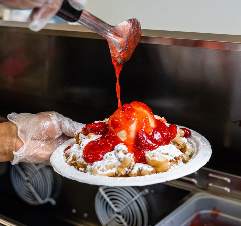 Topped with strawberries, or sweet and savaory options, Braud’s Funnel Cake Cafe is open for pickup.