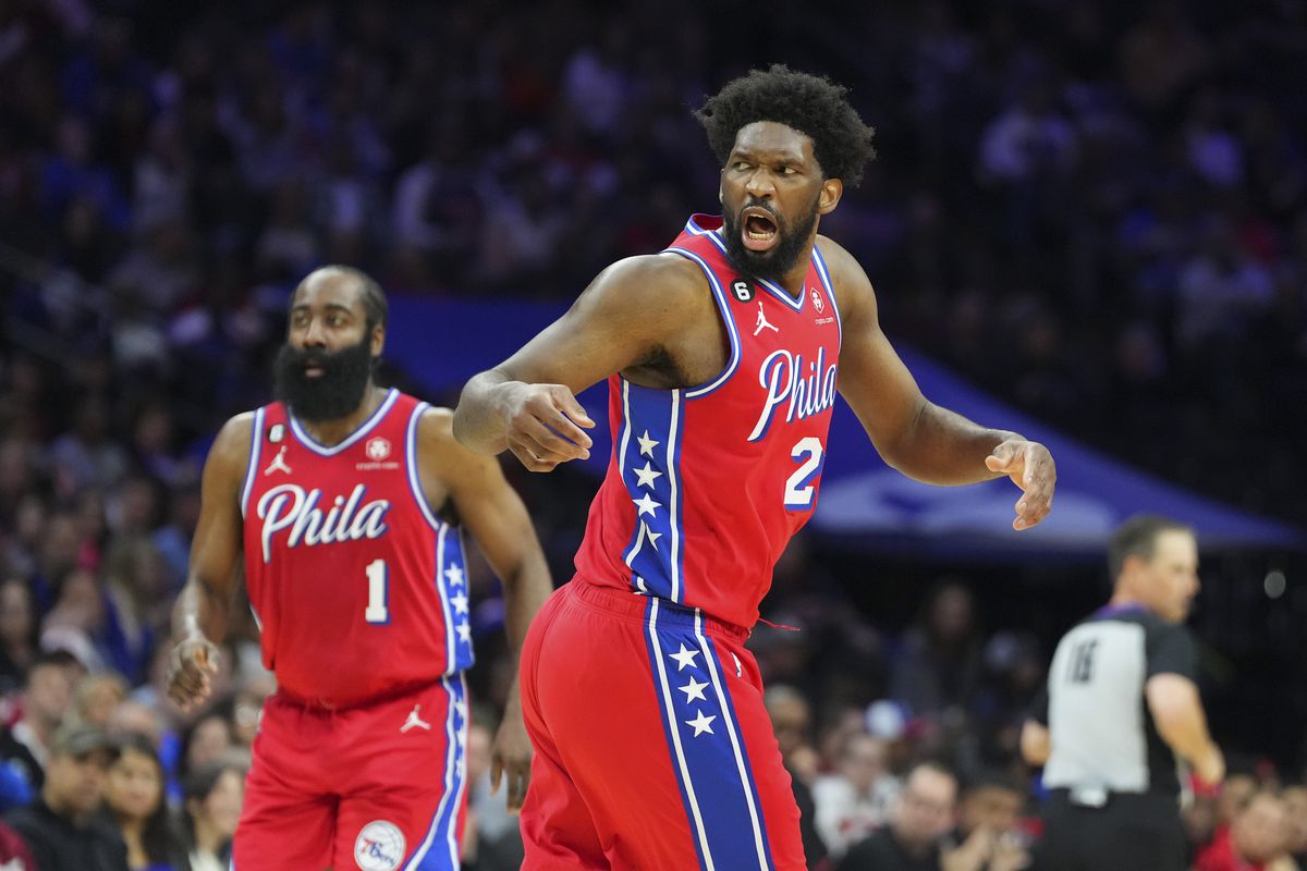 PHILADELPHIA, PA - MARCH 31: Joel Embiid #21 of the Philadelphia 76ers reacts as James Harden #1 looks on against the Toronto Raptors at the Wells Fargo Center on March 31, 2023 in Philadelphia, Pennsylvania. The 76ers defeated the Raptors 117-110.