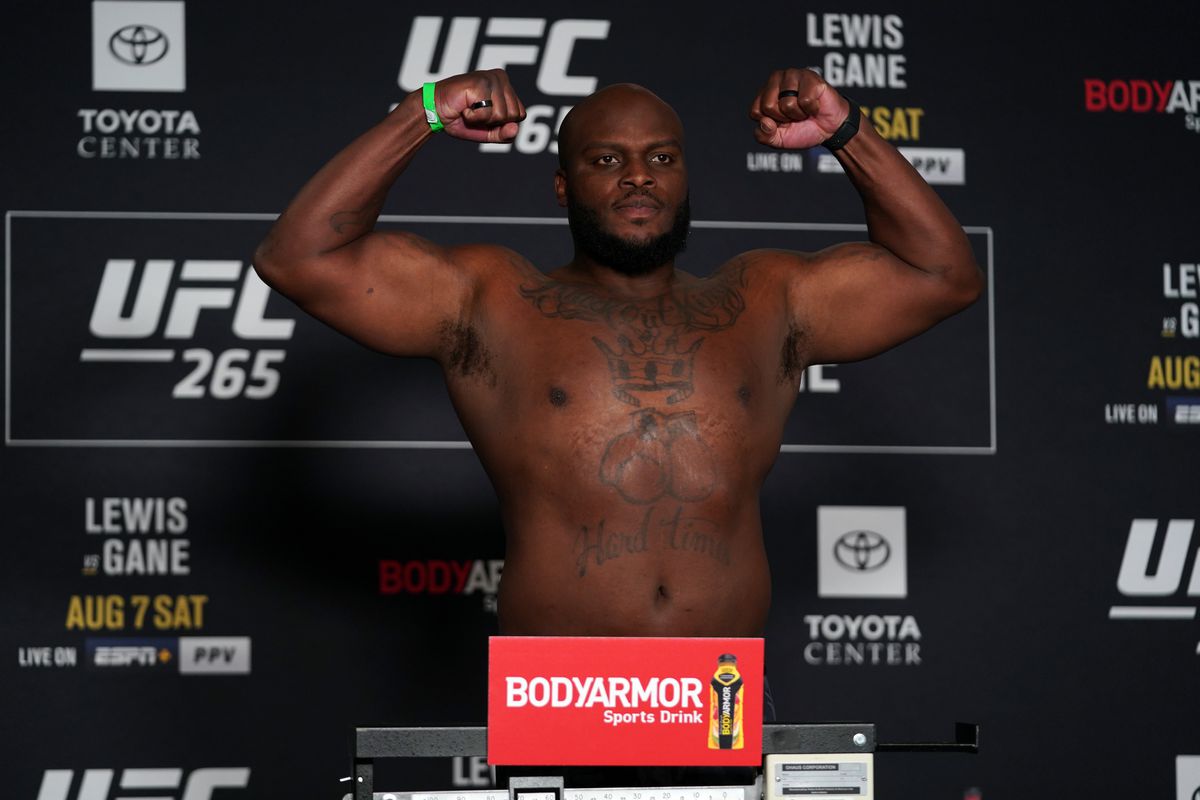 Derrick Lewis poses on the scale during the UFC 265 official weigh-in at Hyatt Regency Houston on August 06, 2021 in Houston, Texas.