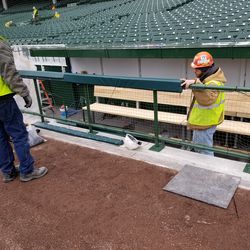 Attaching nets in front of third base dugout