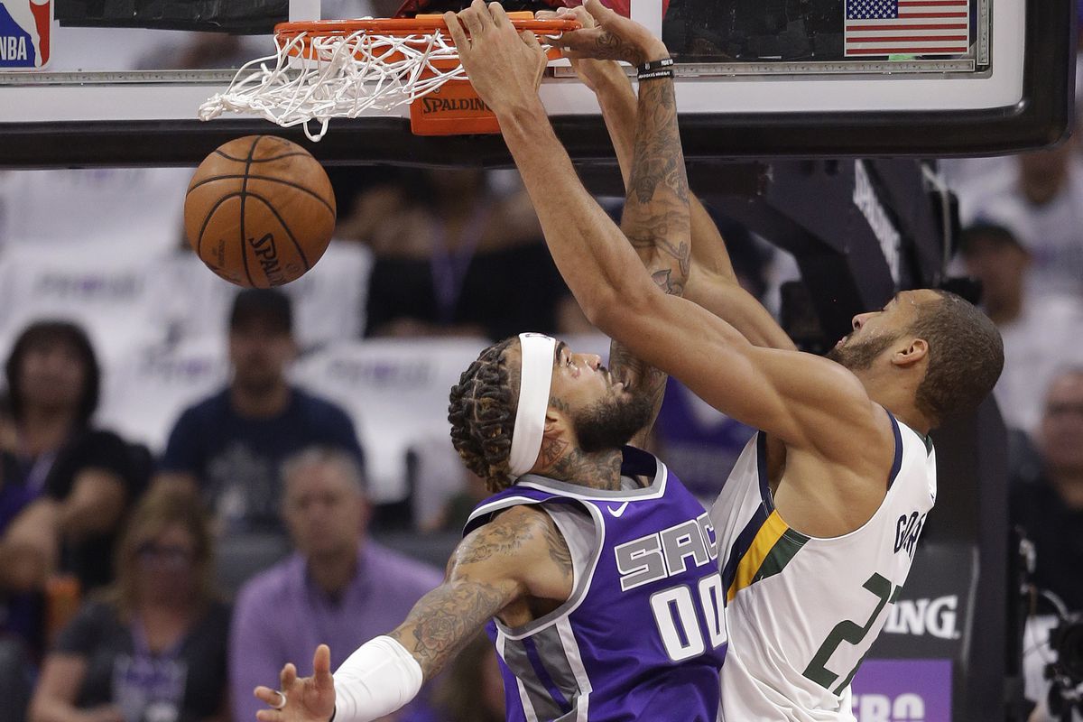 Utah Jazz center Rudy Gobert, right, scores over Sacramento Kings center Willie Cauley-Stein during the first quarter of an NBA basketball game Wednesday, Oct. 17, 2018, in Sacramento, Calif. (AP Photo/Rich Pedroncelli)