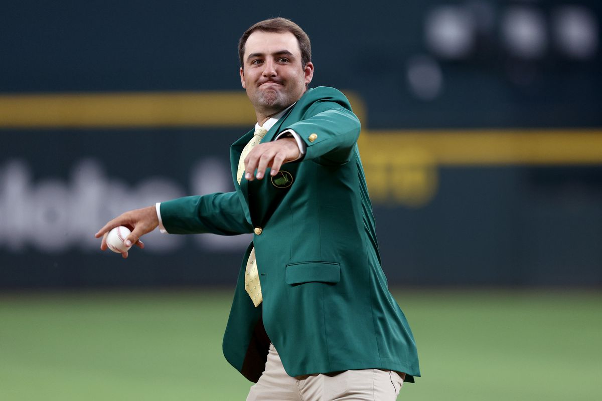 Masters Tournament champion Scottie Scheffler throws out the ceremonial first pitch before the Texas Rangers take on the Houston Astros at Globe Life Field on April 27, 2022 in Arlington, Texas.