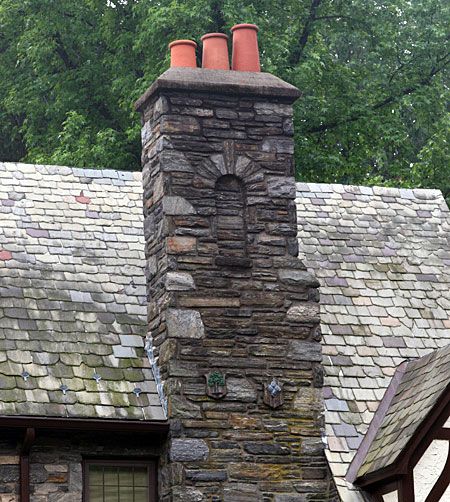 Stone chimney design with decorative and mismatched stones.