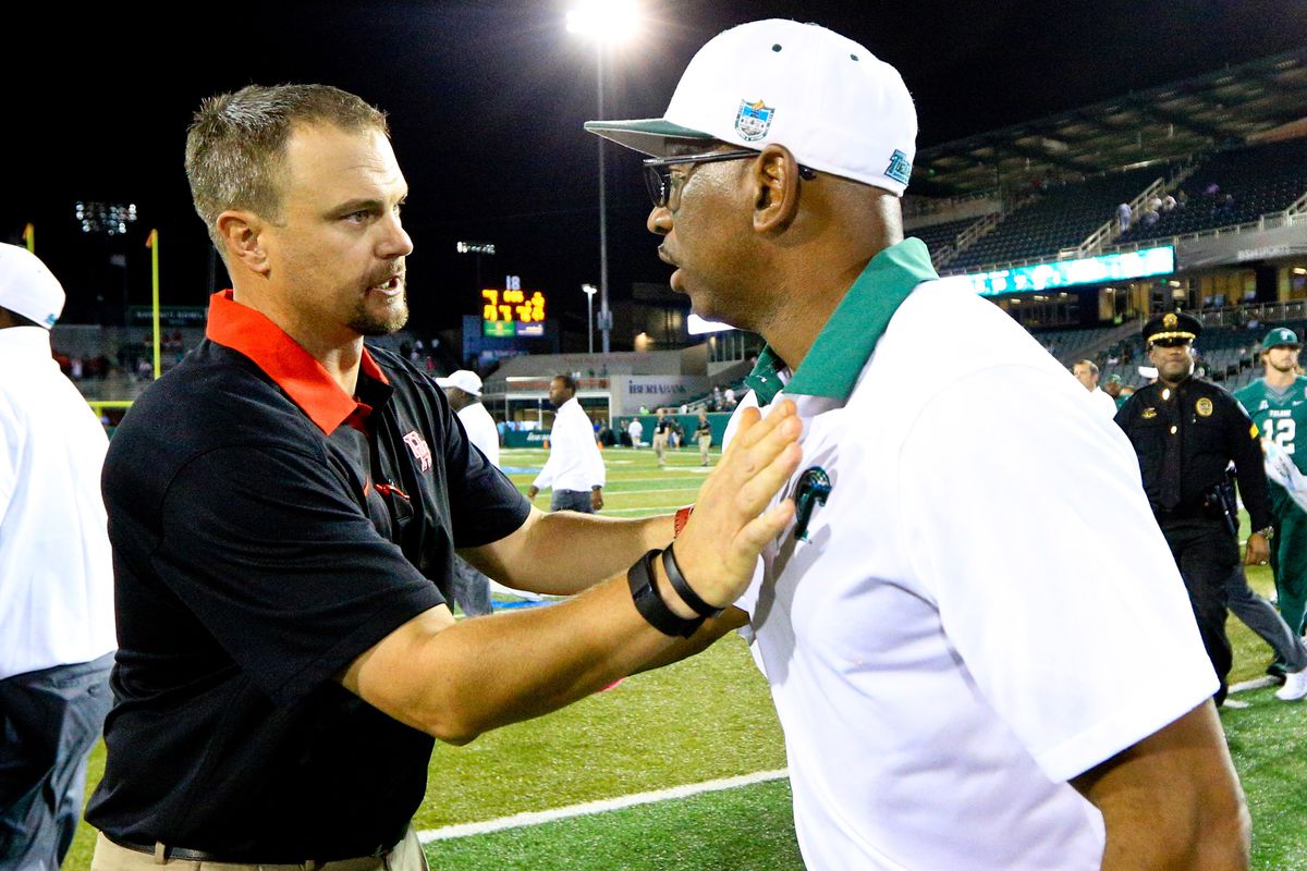 Tom Herman (left) is making $1.45 million this year, but has a buyout of $2.25 million.