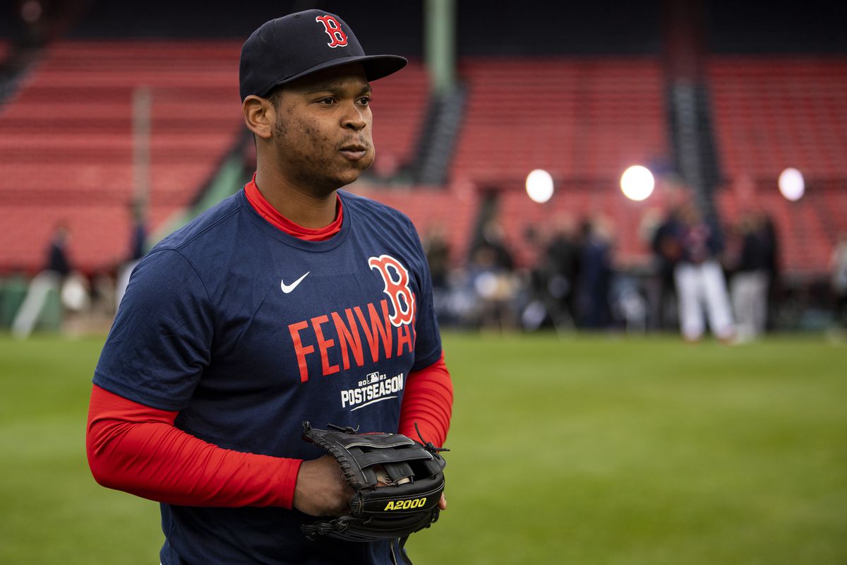 Rafael Devers #11 of the Boston Red Sox warms up before the 2021 American League Wild Card game against the New York Yankees at Fenway Park on October 5, 2021 in Boston, Massachusetts.