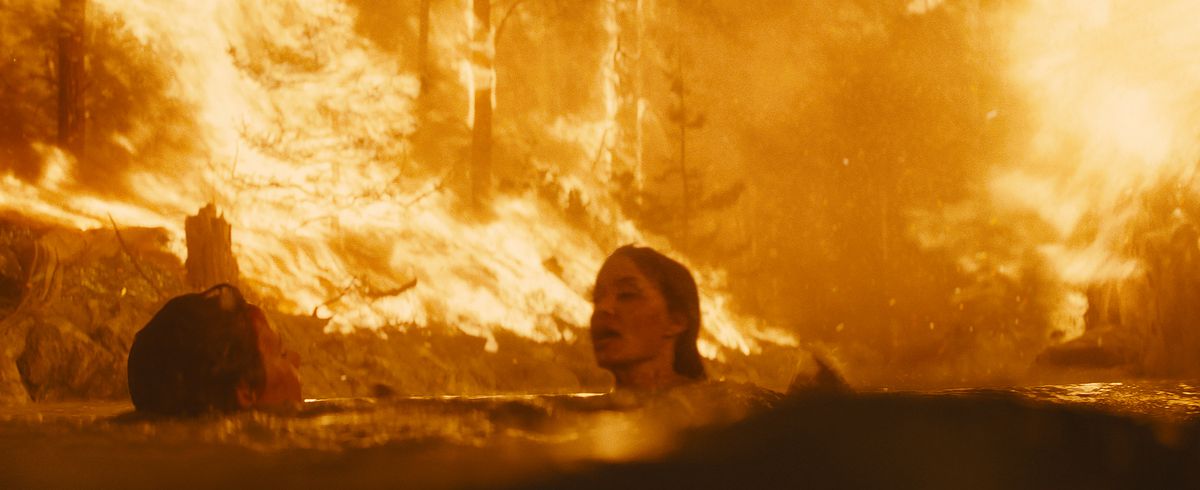 Angelina Jolie in Those Who Wish Me Dead tries to save a boy during a raging forest fire