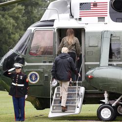 President Donald Trump and first lady Melania Trump board Marine One on the South Lawn of the White House in Washington, Tuesday, Aug. 29, 2017, for a short trip to Andrews Air Force Base, Md. then onto Texas to view the federal government's response to Harvey's devastating flooding in Texas.