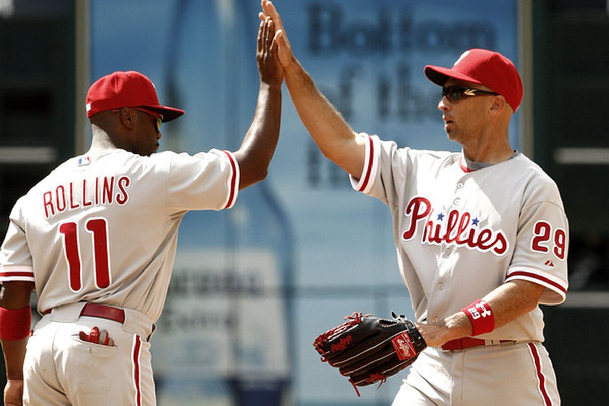 HOUSTON - APRIL 11:  Raul Ibanez #29 of the Philadelphia Phillies high fives Jimmy Rollins #11 after they defeated the Houston Astros 2-1 at Minute Maid Park on April 11, 2010 in Houston, Texas.  (Photo by Bob Levey/Getty Images)