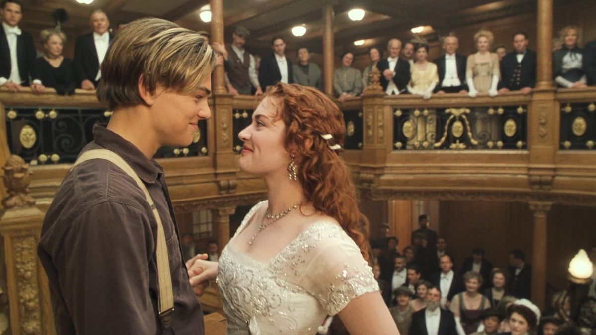 Jack and Rose stare into each others’ eyes as the other Titanic passengers look on at the end of James Cameron’s Titanic