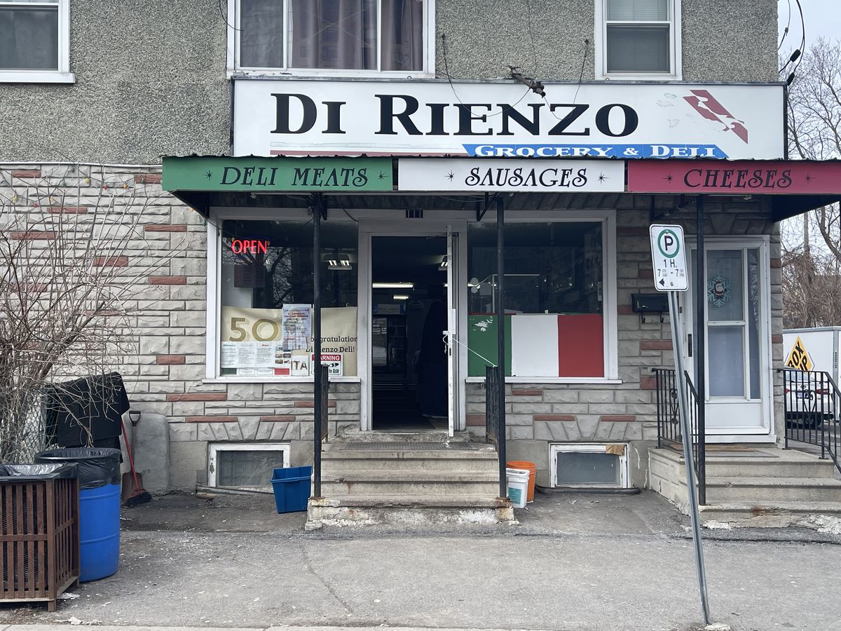 A storefront with Italian flag colors and the name Di Rienzo.