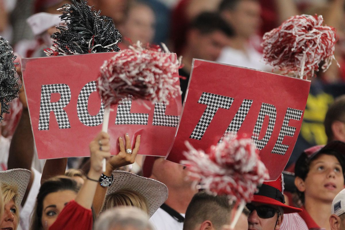 Sep 1, 2012; Arlington, TX, USA; Alabama Crimson Tide fans hold a sign  for roll tide during the game against the Michigan Wolverines at Cowboys Stadium. Mandatory Credit: Matthew Emmons-US PRESSWIRE