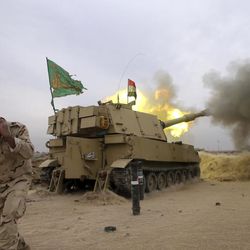 The Iraqi army fires a 155mm shell towards Islamic State militant positions in Mosul, from the village of Ali Rash, east of Mosul, Iraq, Tuesday, Nov. 15, 2016. Iraq launched a major offensive last month to drive IS out of the northern city, the country's second largest, which is still home to more than 1 million civilians. 