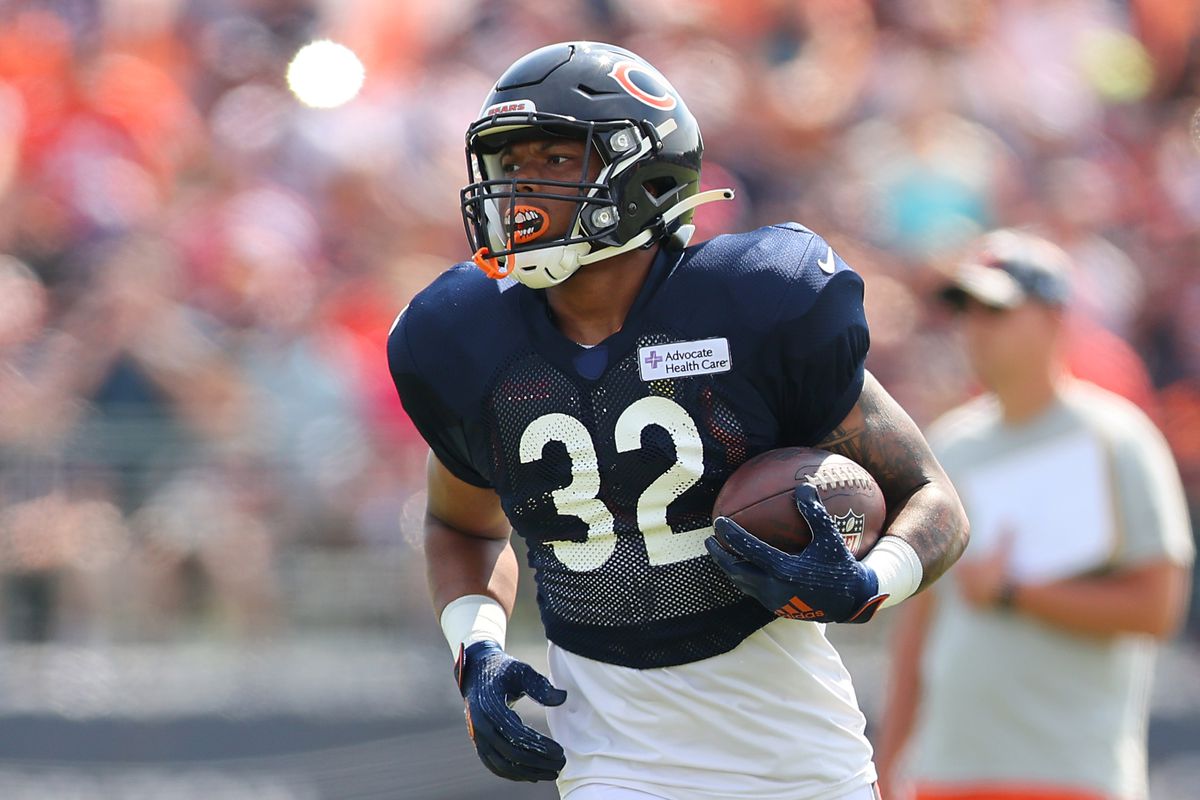 David Montgomery #32 of the Chicago Bears takes part in a drill during training camp at the PNC Center at Halas Hall on August 02, 2022 in Lake Forest, Illinois.