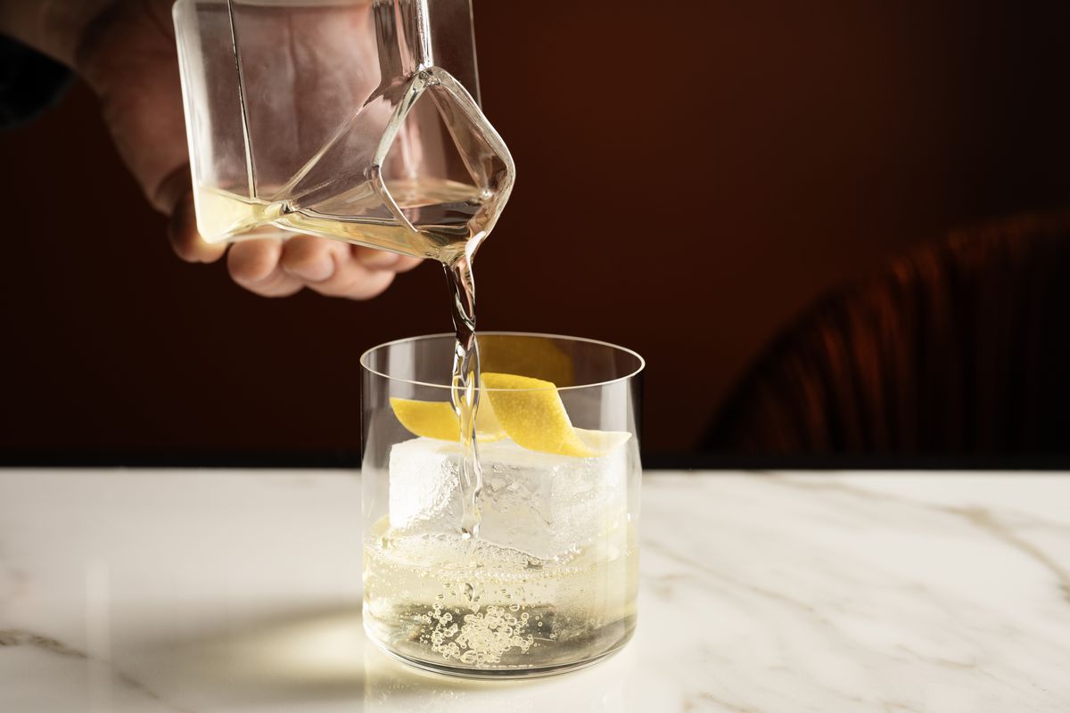 Milk punch being poured into a glass.