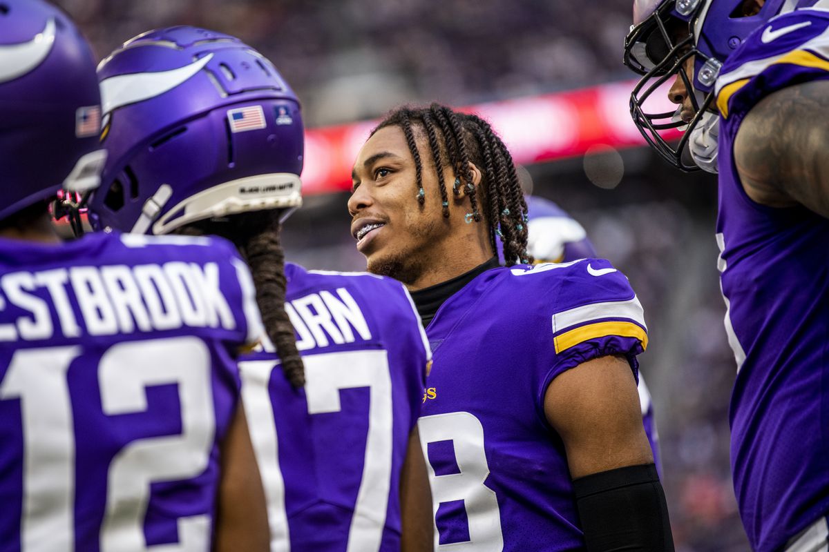 Justin Jefferson #18 of the Minnesota Vikings stands on the sidelines in the third quarter of the game against the Chicago Bears at U.S. Bank Stadium on January 9, 2022 in Minneapolis, Minnesota.