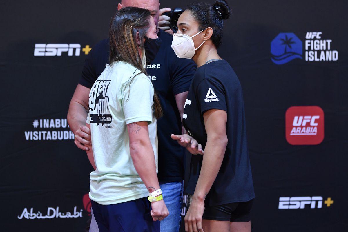 Opponents Molly McCann of England and Taila Santos of Brazil face off during the UFC Fight Night weigh-in inside Flash Forum on UFC Fight Island on July 14, 2020 in Yas Island, Abu Dhabi, United Arab Emirates.