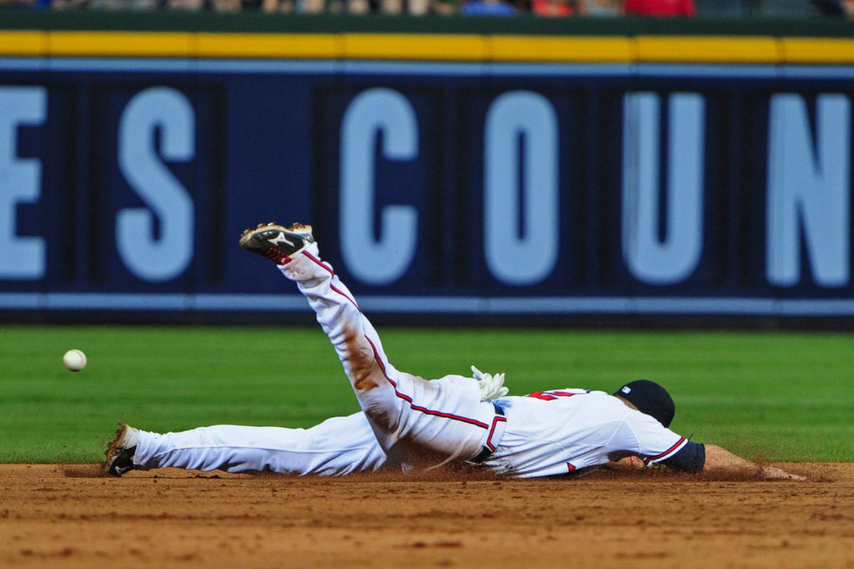 ATLANTA, GA - MAY 30: Jack Wilson #2 of the Atlanta Braves is unable to field a grounder against the St. Louis Cardinals at Turner Field on May 30, 2012 in Atlanta, Georgia. (Photo by Scott Cunningham/Getty Images)