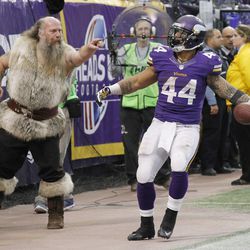 Minnesota Vikings running back Matt Asiata reacts after scoring on a 1-yard touchdown run during the second half of an NFL football game against the Philadelphia Eagles, Sunday, Dec. 15, 2013, in Minneapolis.