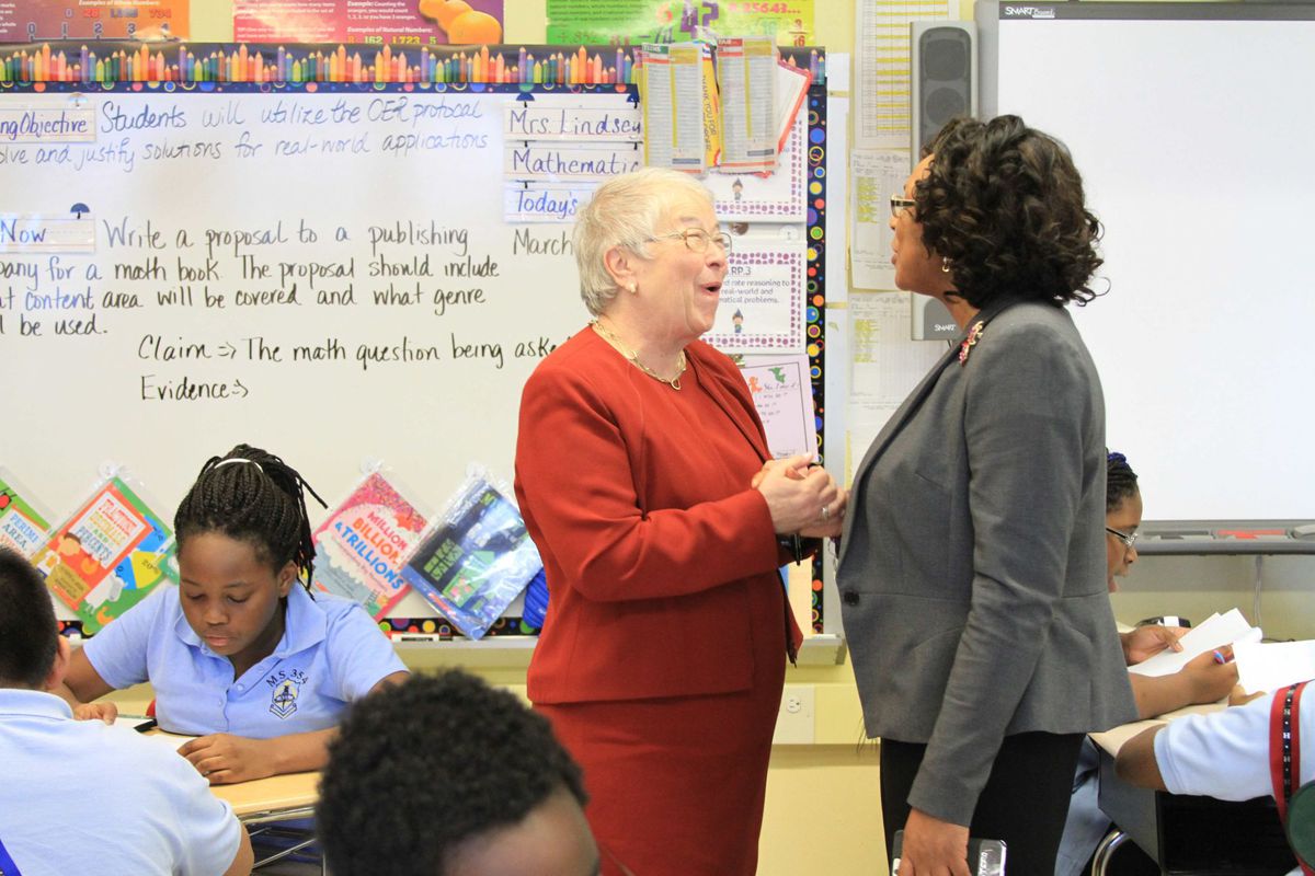 Chancellor Carmen Fariña speaks with Monique Campbell, the principal of The School of Integrated Learning, one of the city schools that will begin absorbing a struggling middle school next year.