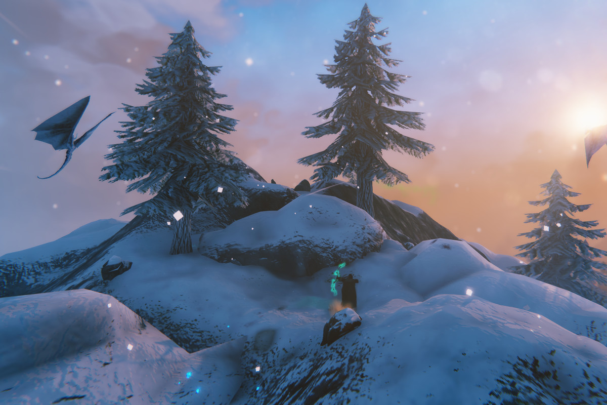 Valheim - a viking stands on a snowy mountain, using their bow to attack a bird in the distance.