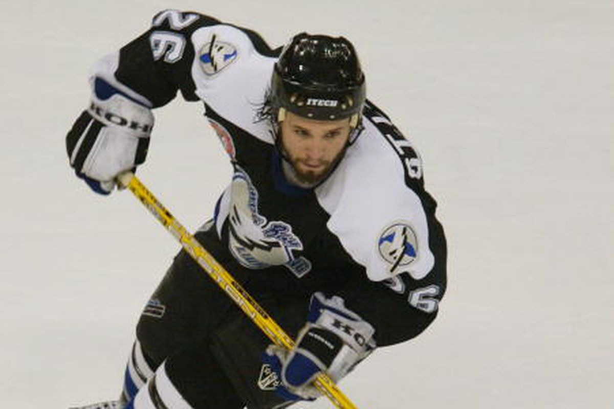 TAMPA, FL - JUNE 3: Right wing Martin St. Louis #26 of the Tampa Bay Lightning advances the puck against the Calgary Flames in Game five of the NHL Stanley Cup Finals at the St. Pete Times Forum on June 3, 2004.