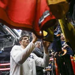 Utah Jazz guard Kyle Korver (26) signs jerseys for fans before playing the Minnesota Timberwolves at Vivint Arena in Salt Lake City on Thursday, March 14, 2019.
