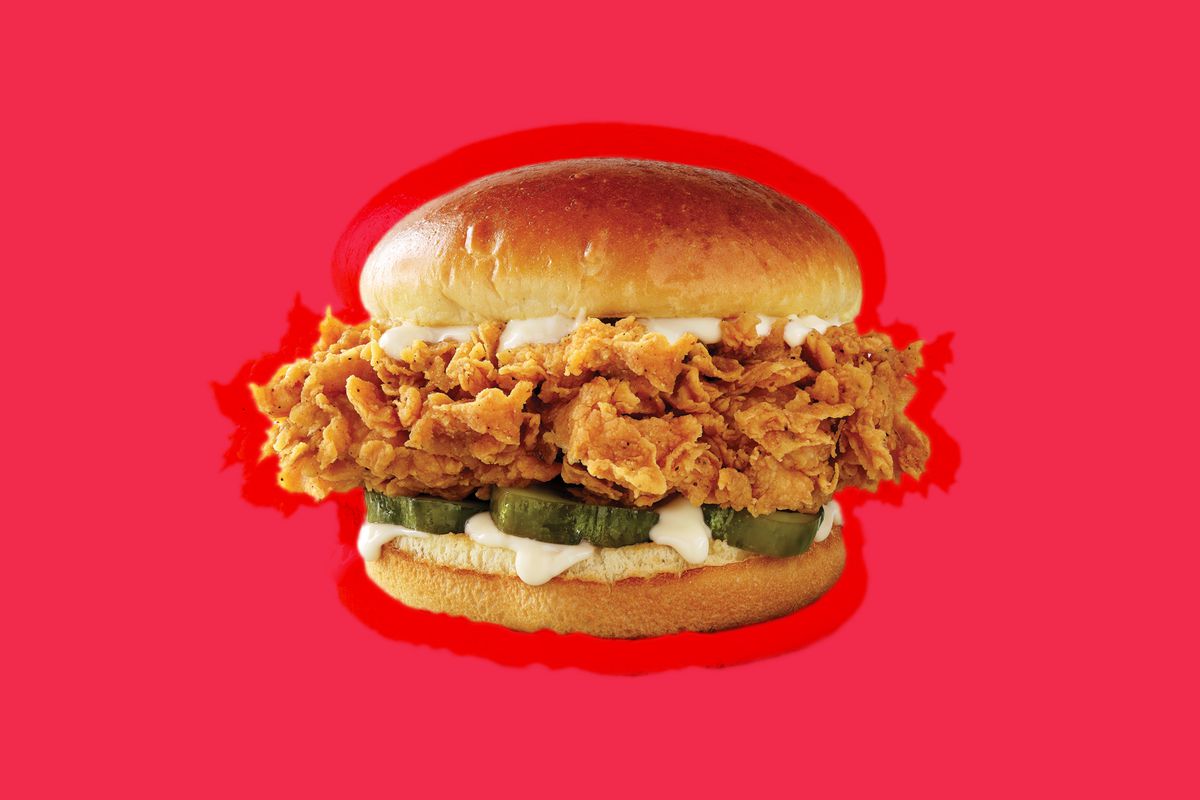 KFC chicken sandwich on a red background.