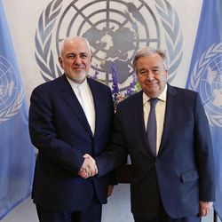 Iranian Foreign Minister Mohammad Javad Zarif, left, shakes hands with U.N. Secretary General Antonio Guterres at United Nations headquarters Thursday, July 18, 2019. (AP Photo/Frank Franklin II)