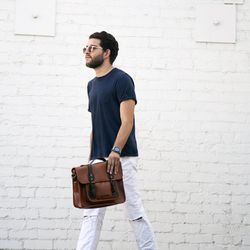 Gregory of <a href="http://www.downtowndava.com"target="_blank">Downtown Dava</a> is wearing a Ted Baker satchel. 