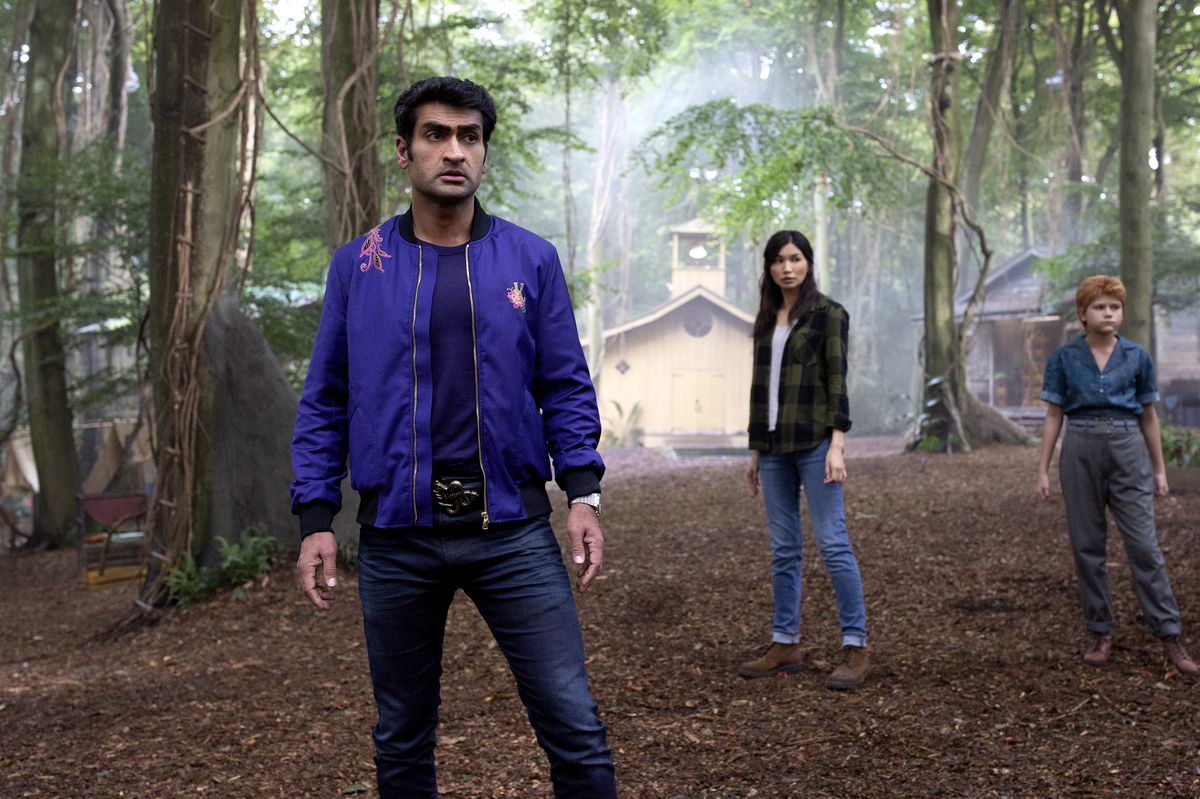 Kingo (Kumail Nanjiani), Sersi (Gemma Chan) and Sprite (Lia McHugh) stand in the forest in civilian clothes in Marvels Eternals. 