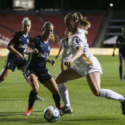 Utah Royals FC forward Amy Rodriguez (8) dribbles the ball looking to score against the Seattle Reign FC during their match at Rio Tinto Stadium in Sandy on Friday, June 28, 2019.