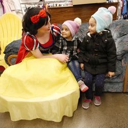 Snow White talks with shoppers Natalie and Naomi Figueroa at Goodwill in Millcreek on Saturday, Dec. 3, 2016. The Rotary Club of Midvale partnered with the Unified Police Department for 102 needy children to shop.