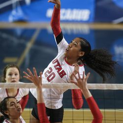 Utah middle blocker Tawnee Luafalemana (20) puts the ball over in an NCAA first round match against UNLV at Smith Fieldhouse in Provo on Friday, Dec. 2, 2016.