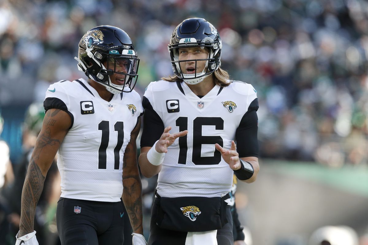 Trevor Lawrence #16 and Marvin Jones #11 of the Jacksonville Jaguars in action against the New York Jets at MetLife Stadium on December 26, 2021 in East Rutherford, New Jersey. The Jets defeated the Jaguars 26-21.