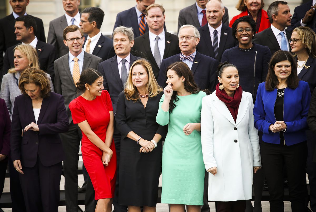 Representatives-elect Alexandria Ocasio-Cortez (D-NY), Debbie Mucarsel-Powell (D-FL), Abby Finkenauer (D-IA), and Sharice Davids (D-KS) join with other newly elected members of the House of Representatives for an official class photo of new House members.