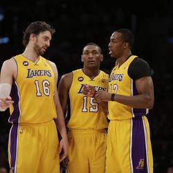 Los Angeles Lakers' Pau Gasol, left, of Spain, Metta World Peace, center, and Dwight Howard chat during the first half of an NBA basketball game against the Houston Rockets in Los Angeles, Wednesday, April 17, 2013. (AP Photo/Jae C. Hong)