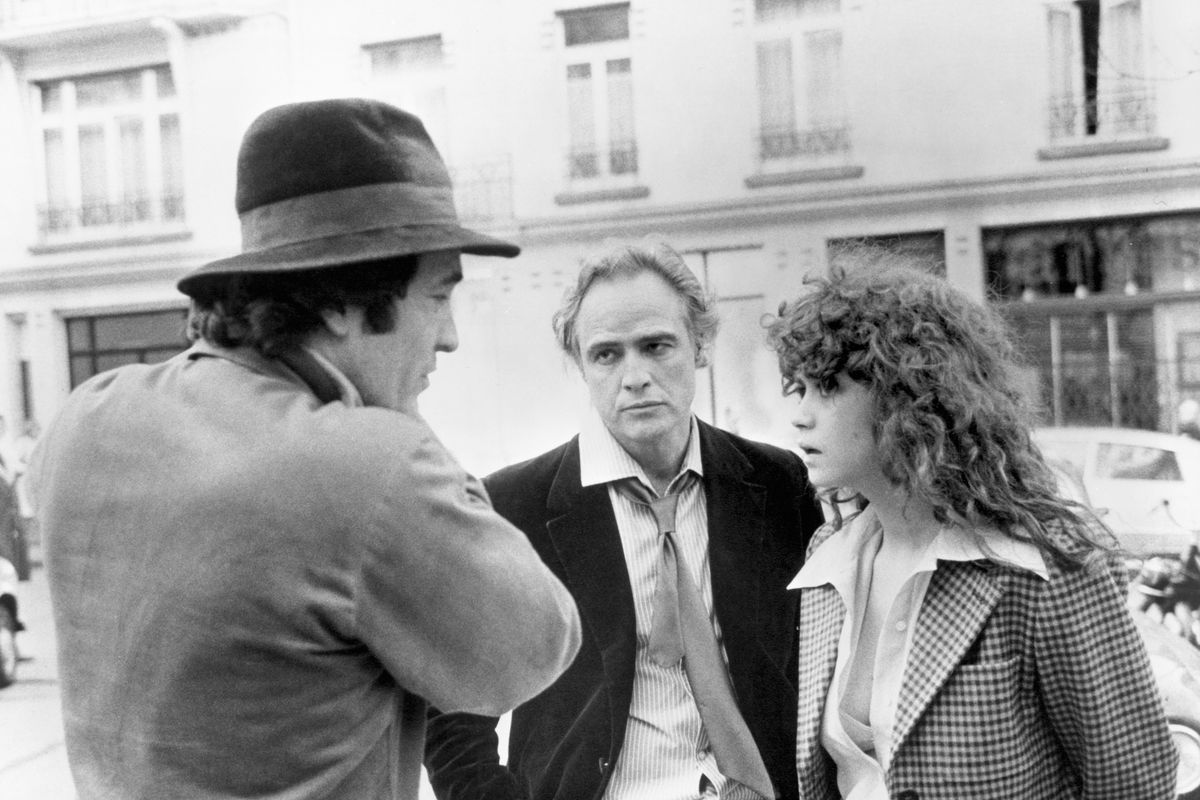 Director Bernardo Bertolucci (left) with actors Maria Schneider (right) and Marlon Brando (center) during the filming of Last Tango in Paris