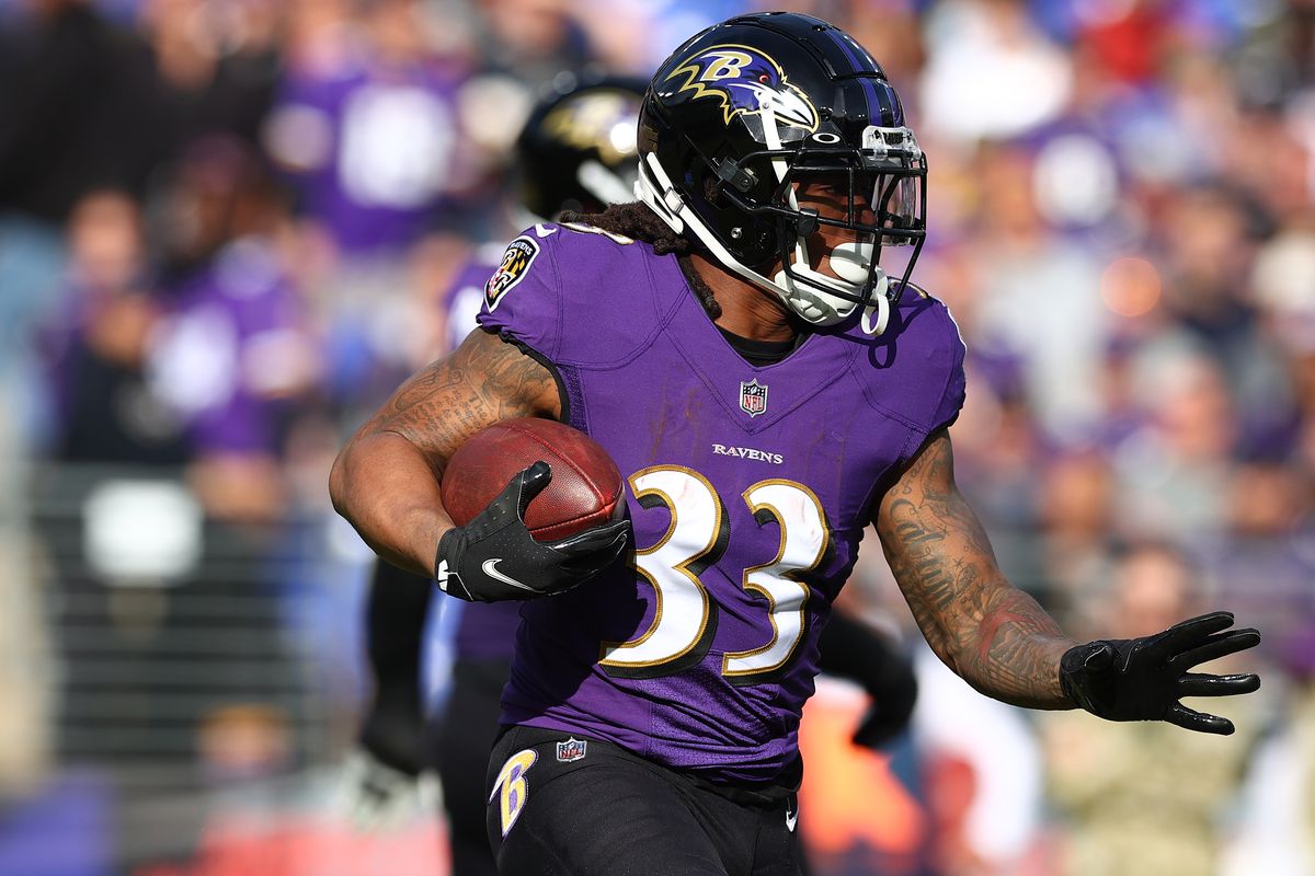 Devonta Freeman #33 of the Baltimore Ravens runs with the ball against the Minnesota Vikings in the second quarter at M&amp;T Bank Stadium on November 07, 2021 in Baltimore, Maryland.