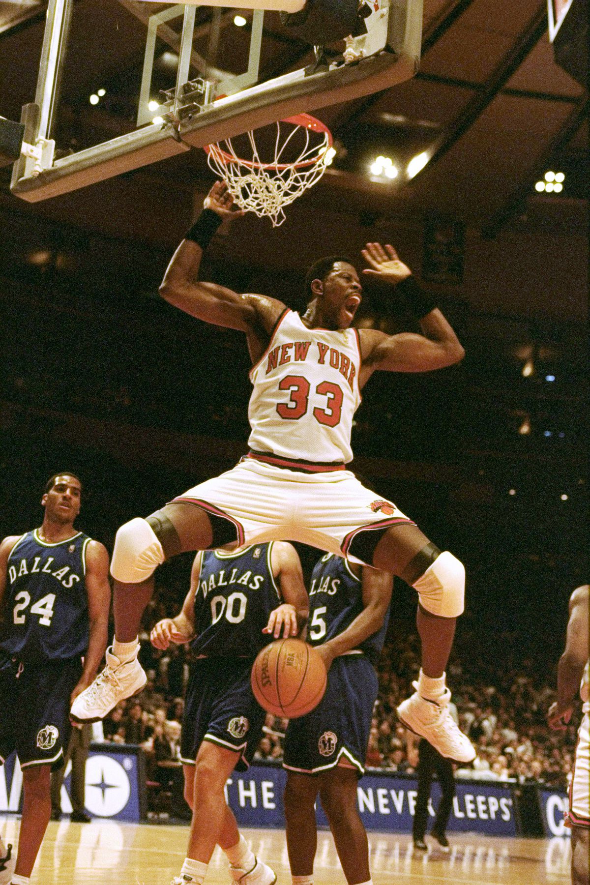 Patrick Ewing (33) of the New York Knicks dunks during game